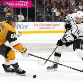 Angus Booth (81) shoots against the stick of Vegas Golden Knights right wing Jonas Rondbjerg (46)