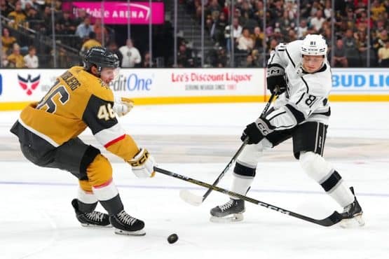 Angus Booth (81) shoots against the stick of Vegas Golden Knights right wing Jonas Rondbjerg (46)