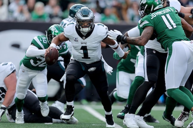 Philadelphia Eagles quarterback Jalen Hurts (1) escapes pocket pressure