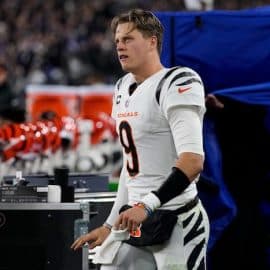 Cincinnati Bengals quarterback Joe Burrow (9) emerges from the examination tent