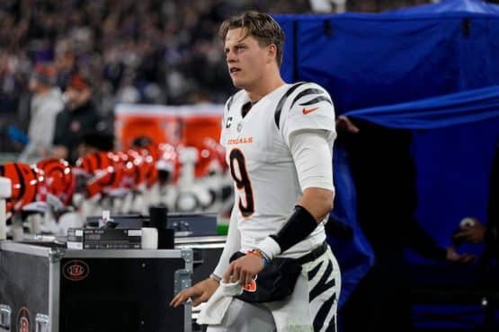 Cincinnati Bengals quarterback Joe Burrow (9) emerges from the examination tent