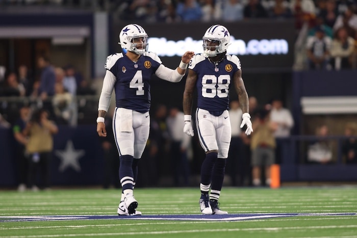 Dallas Cowboys wide receiver CeeDee Lamb (88) and quarterback Dak Prescott (4)