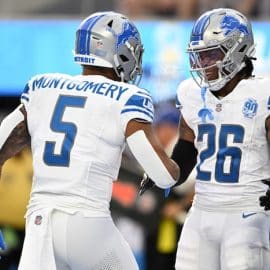 Detroit Lions running back Jahmyr Gibbs (26) celebrates with running back David Montgomery