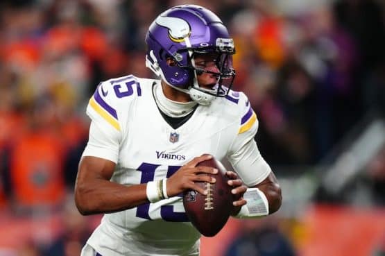 Minnesota Viking quarterback Joshua Dobbs (15) drops back to pass against the Denver Broncos