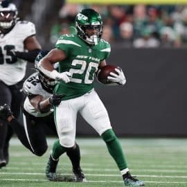 New York Jets running back Breece Hall (20) fights