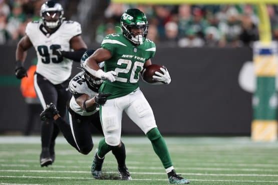 New York Jets running back Breece Hall (20) fights