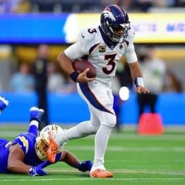 Denver Broncos quarterback Russell Wilson (3) runs the ball