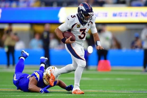 Denver Broncos quarterback Russell Wilson (3) runs the ball