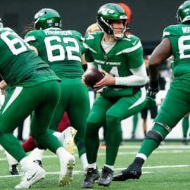 New York Jets quarterback Trevor Siemian (14) is shown before handing the ball to a teammate