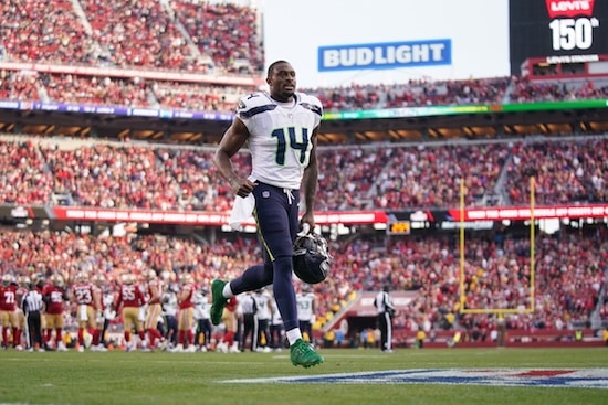 Seattle Seahawks wide receiver DK Metcalf (14) runs towards the locker room