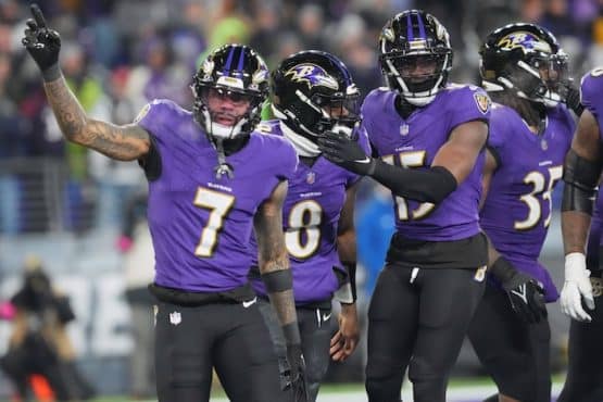 Baltimore Ravens quarterback Lamar Jackson (8) celebrates with wide receiver Rashod Bateman (7)