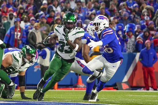 New York Jets running back Dalvin Cook (33) runs with the ball Buffalo Bills defensive end Leonard Floyd (56