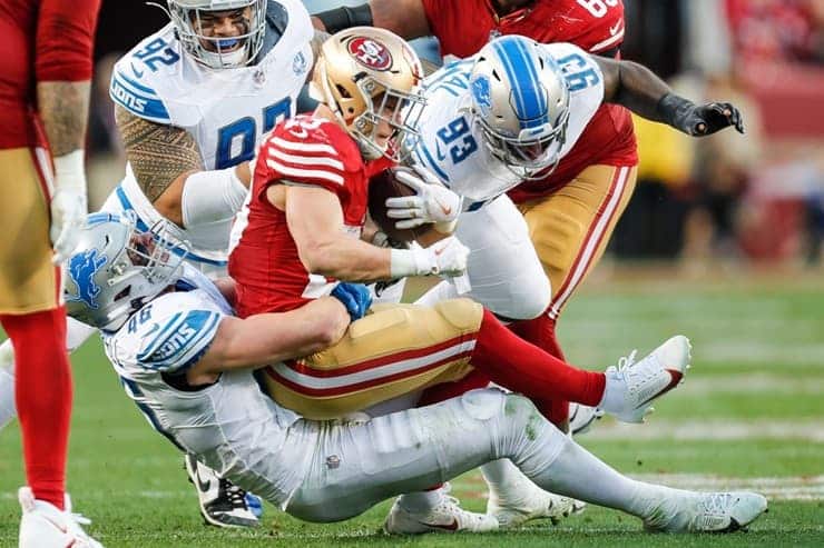 christian mcaffrey tackled by jack campbell (1)