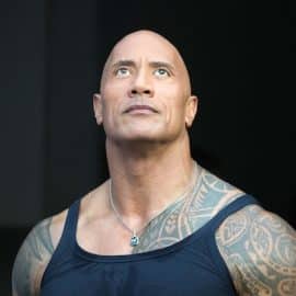 American actor Dwayne Johnson attends the game
