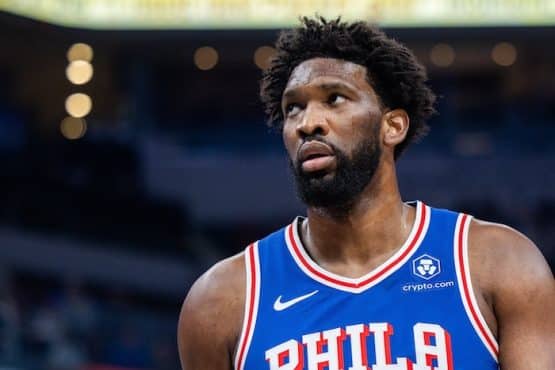 Joel Embiid looks up and stares.