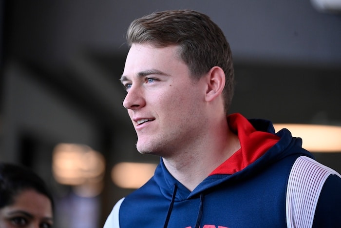 New England Patriots quarterback Mac Jones (10) arrives to a press conference