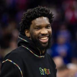 Injured Philadelphia 76ers center Joel Embiid smiles