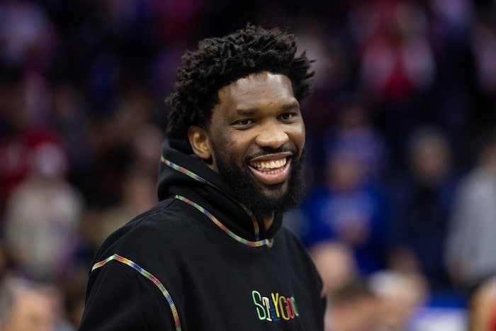 Injured Philadelphia 76ers center Joel Embiid smiles