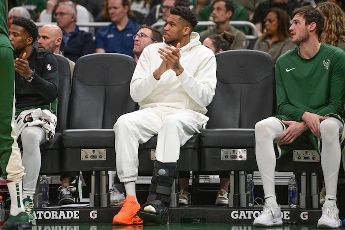Milwaukee Bucks forward Giannis Antetokounmpo (34) sits on the bench