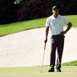 Tiger Woods waits to putt on no. 13 during a practice round for the Masters Tournament