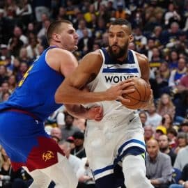 Minnesota Timberwolves center Rudy Gobert (27) and Denver Nuggets center Nikola Jokic (15)