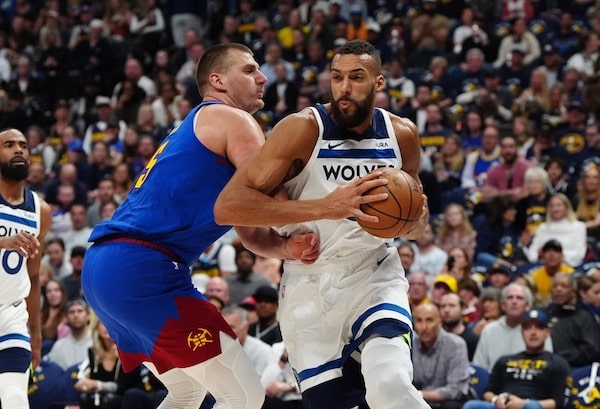Minnesota Timberwolves center Rudy Gobert (27) and Denver Nuggets center Nikola Jokic (15)