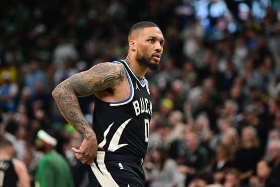 Damian Lillard holds his hands on his side.
