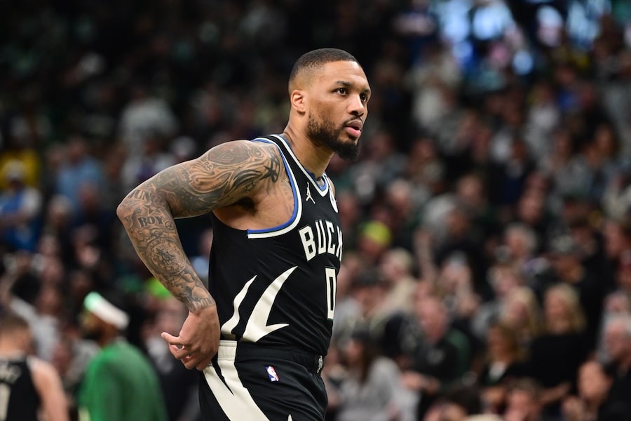 Damian Lillard holds his hands on his side.