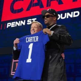 NFL commissioner Roger Goodell with Penn State Nittany Lions Abdul Carter holding a jersey.
