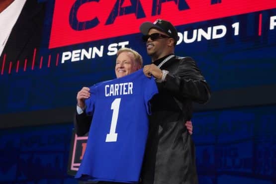 NFL commissioner Roger Goodell with Penn State Nittany Lions Abdul Carter holding a jersey.
