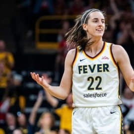 Indiana Fever guard Caitlin Clark holds her hands out.
