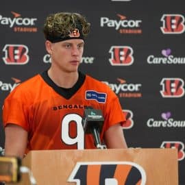 Joe Burrow stands in front of the mic.