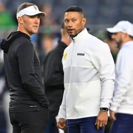 USC Trojans head coach Lincoln Riley and Notre Dame Fighting Irish head coach Marcus Freeman.