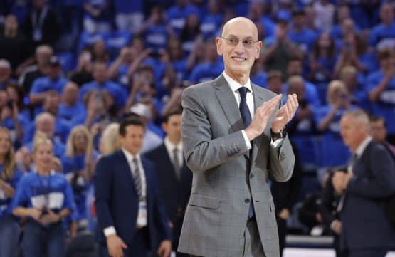 Adam Silver claps his hands.