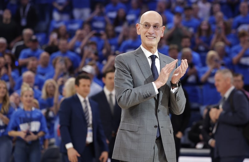 Adam Silver claps his hands.