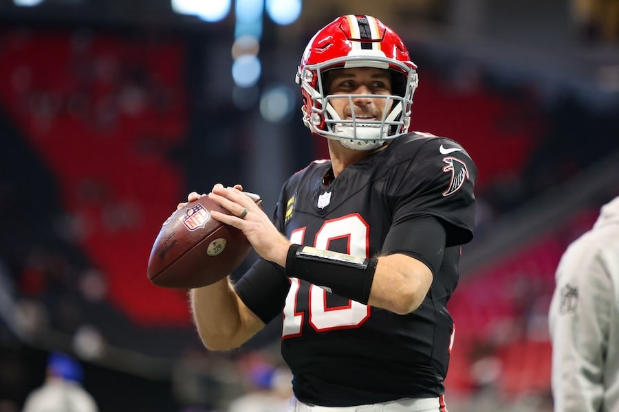 Kirk Cousins holds the ball and prepares to throw.