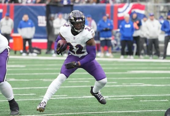 Baltimore Ravens running back Derrick Henry runs the ball.