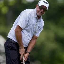 Phil Mickelson stares at a putt.