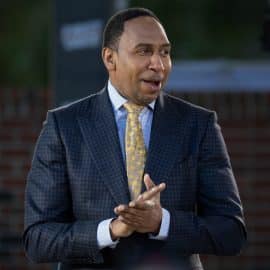 Stephen A. Smith clasps his hands.
