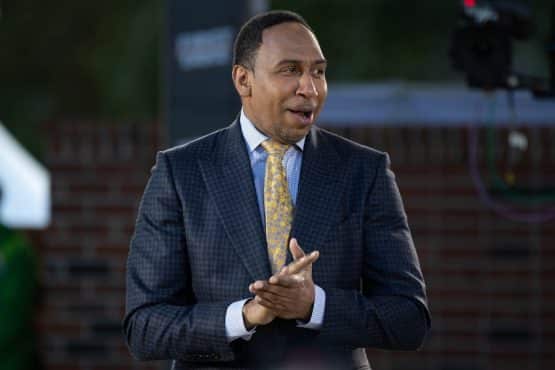 Stephen A. Smith clasps his hands.