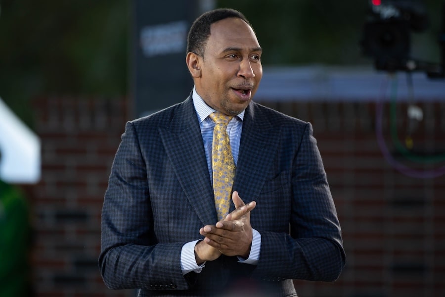 Stephen A. Smith clasps his hands.